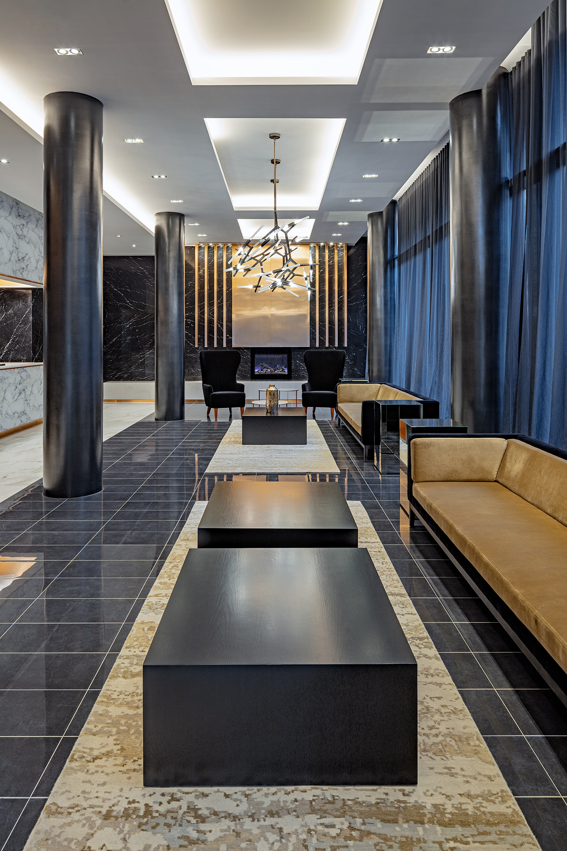 Lobby with stone walls and floors, Peter A. Sellar Architectural ...